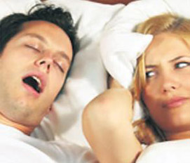 Photo of woman annoyed by snoring man